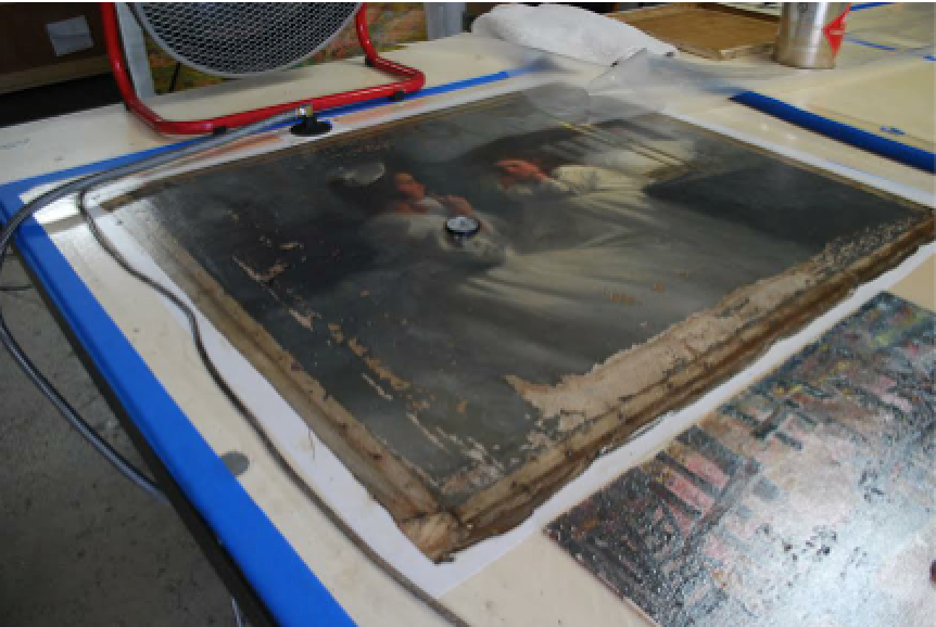 Stopping flaking on a water damaged painting on the hot table