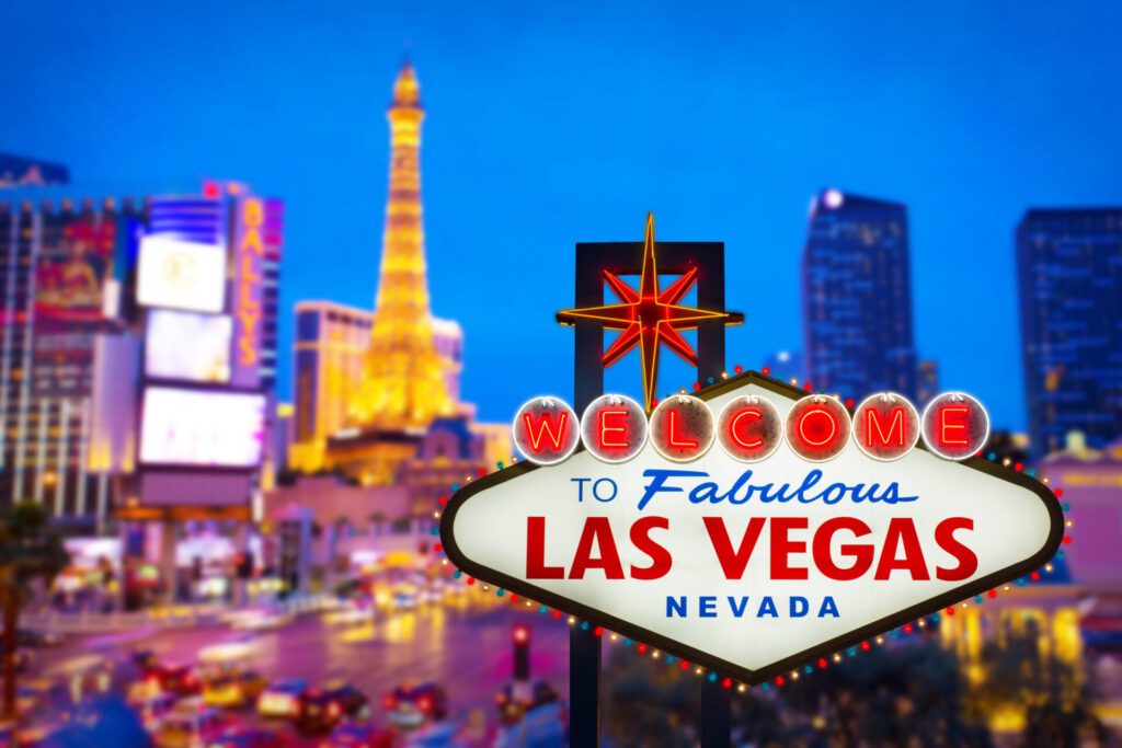 image of the Las Vegas welcome sign with the strip in the background 