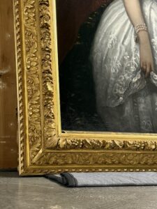 Antique gilded frame repair next to a restored heirloom oil painting https://www.FineArtConservationLab.com